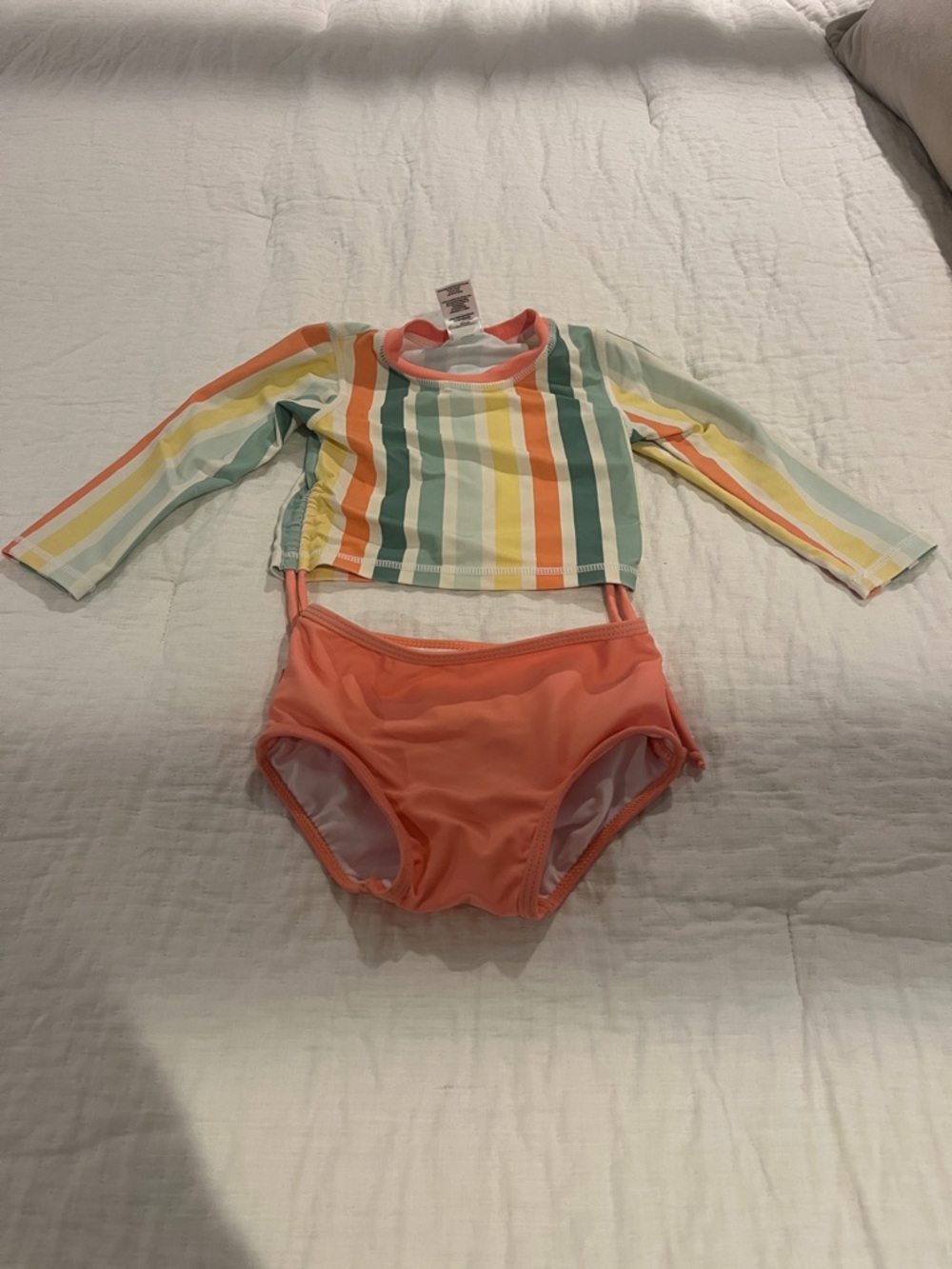Ruffle Butts Girls' Coral Two-Piece Swim Set with Multicolor Striped Rash Guard